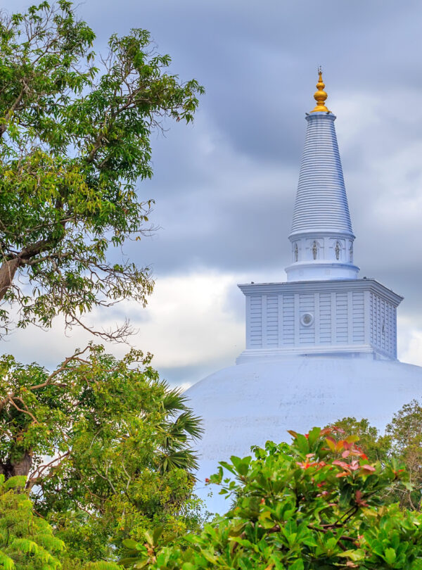 Scenic view of Ruwanwelisaya white stupa on jungle background in Anuradhapura, Sri Lanka
